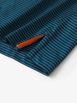Hem slit detail – Turquoise Stripe Performance Cooling Polo for youth
