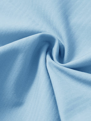 Close-up of fabric on lightweight flat front casual trousers, highlighting texture and finish in light blue.