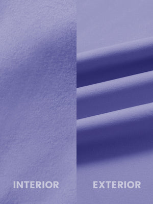 Close-up of inside and outside fabric of water-resistant fleece golf vest in lavender, highlighting material texture and durability for optimal performance.