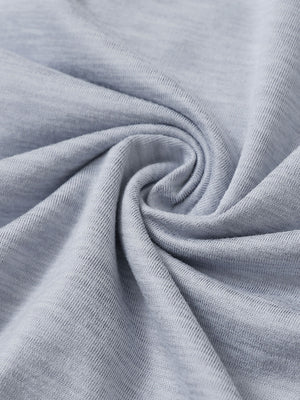 Fabric close-up of quarter zip hoodie with kangaroo pocket, soft texture and cozy feel in faded denim heather