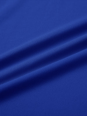 Close-up of cobalt ventilated pique performance polo fabric texture.