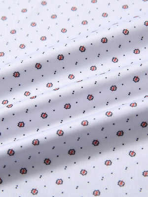 Close-up fabric detail of performance quick dry print golf polos, breathable texture with white geo pattern
