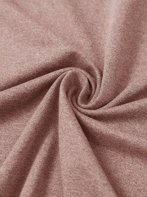 Close-up of fabric on men's long sleeve mock turtleneck shirt, soft knit texture with subtle stretch in pink heather