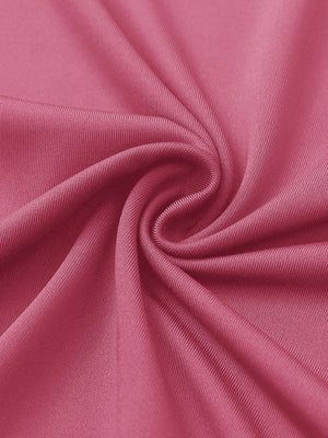 Close-up of rose women's performance solid polo fabric texture.