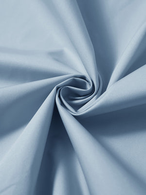 Detail of the lightweight water-repellent softshell hooded jacket in slate blue, fabric twisted into a spiral roll.