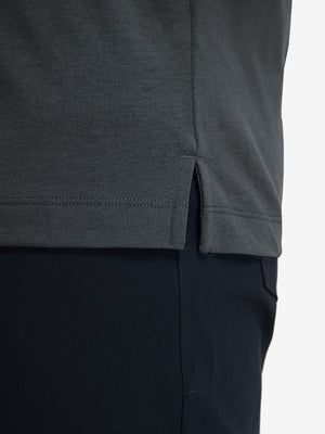 Detail shot of the hem on the greystone heather comfy cotton blend polo shirt with pocket, emphasizing the bottom edge design