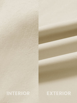 Close-up of the inner and outer fabric of water-resistant fleece golf vests in light khaki, showing fleece lining and exterior.