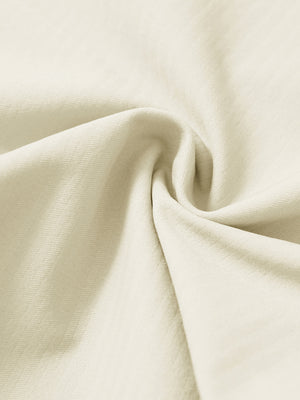 Close-up of fabric on lightweight flat front casual trousers, highlighting texture and finish in beige.