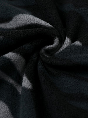 Fabric close-up of Polar fleece q-zip hooded with 3 pockets showing soft texture in black camo