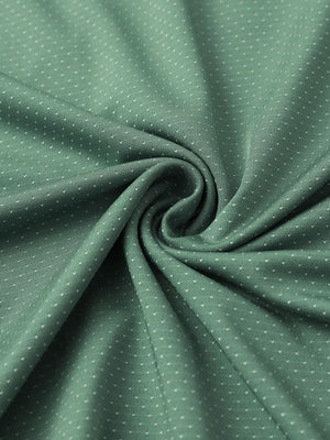 Close-up of beryl green 4 way stretch jacquard polo fabric texture highlighting intricate woven pattern and elasticity.