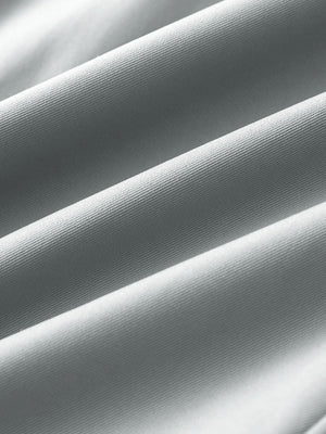 Close-up of fabric on water resistant everyday pants, showing texture and finish in light grey.