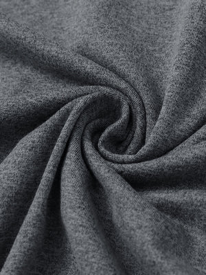 Fabric close-up of quarter zip hoodie with kangaroo pocket, soft texture and cozy feel in black grey heather