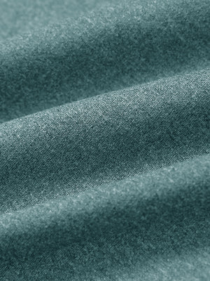 Close-up fabric detail of moisture wicking quarter zip pullover, smooth knit and quick-dry feel in dark green melange