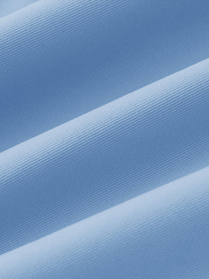 Fabric close-up of Women's 7/8 ankle golf track pants with soft texture in light blue