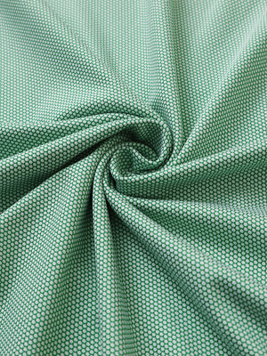 Close-up of emerald performance ananas jacquard polo fabric showing refined texture.