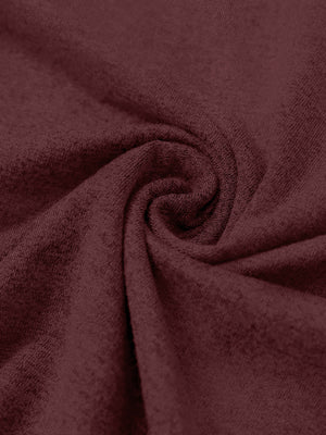 Close-up fabric detail of skin-friendly long sleeve melange polo, soft blend texture with burgundy tone