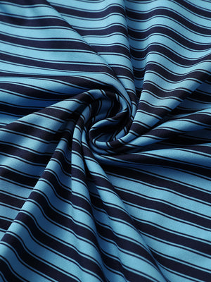 Close-up of navy blue yarn dyed stripe polo fabric showing distinct woven stripes and textured surface.