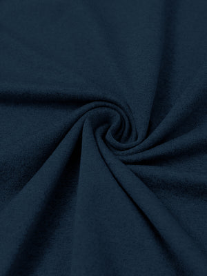 Close-up of fabric on men's long sleeve mock turtleneck shirt, soft knit texture with subtle stretch in navy