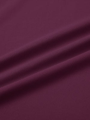 Fabric detail of Long sleeve performance solid pique polo with breathable knit in bordeaux red