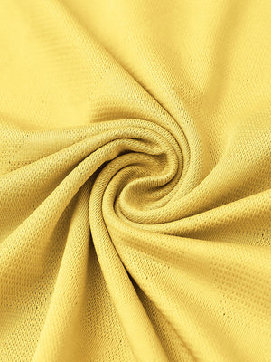 Close-up of yellow modern texture stylish polo fabric showing surface detail.