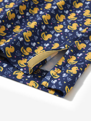 Close-up of the hem vent on the yellow duck 4 way stretch print collared polo shirt, showing the side split for movement