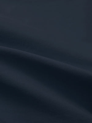 Close-up texture of navy flat front flex cotton blend golf shorts fabric showing detailed cotton blend material and weave.