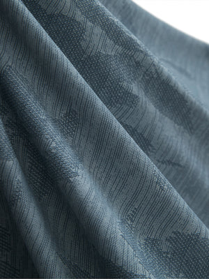 Close-up of blue flower breathable jacquard pattern 3-button golf polo fabric texture