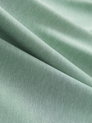 Close-up of grey green ultra-light quick dry moisture wicking collared polo shirt fabric texture