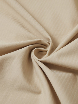 Close-up fabric detail of lightweight water-resistant outerwear jacket, smooth khaki texture