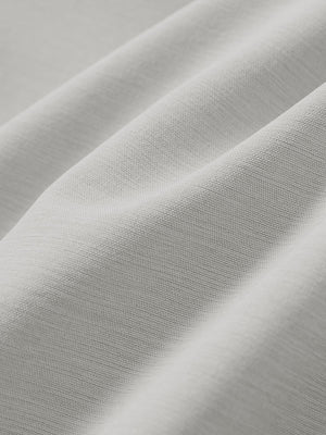 Close-up texture of light gray straight fit lightweight dress golf pants fabric showing detailed lightweight weave and material.
