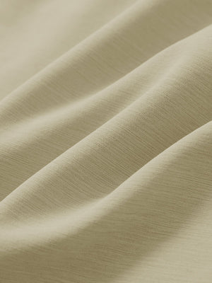 Close-up texture of khaki straight fit lightweight dress golf pants fabric showing detailed lightweight weave and material.