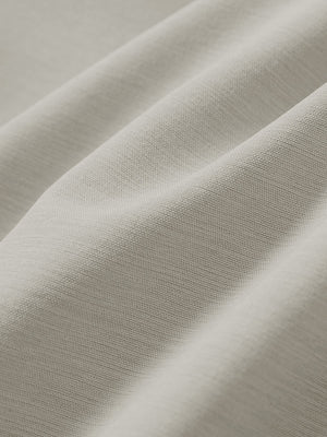 Close-up texture of fossil straight fit lightweight dress golf pants fabric showing detailed lightweight weave and material.