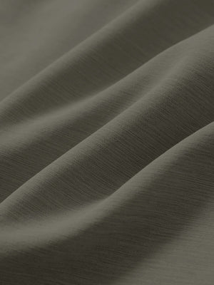 Close-up texture of tea brown straight fit lightweight dress golf pants fabric showing detailed lightweight weave and material.