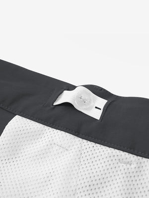 Interior shot of the waistband on the dark grey youth water resistant cotton blend golf pants, showing inner construction