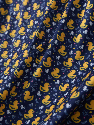 Macro view of the yellow duck 4 way stretch print collared polo shirt fabric, showcasing the unique print design