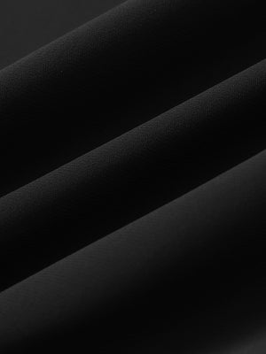 Close-up of fabric on 2 in 1 running sports shorts with liner, showing texture and finish in black