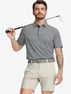 Front half-body shot of model holding golf club, wearing Sport Fit Stripe Polo in Black Stripe