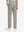 Back lower body view of model wearing the khaki grey youth water resistant cotton blend golf pants, highlighting the rear design
