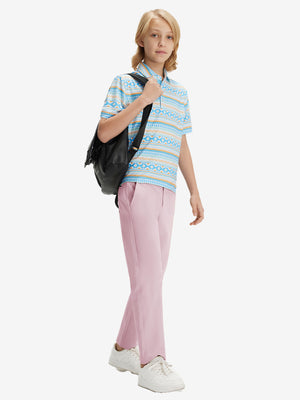 Full-body front view of model wearing the pink youth water resistant cotton blend golf pants for a complete look