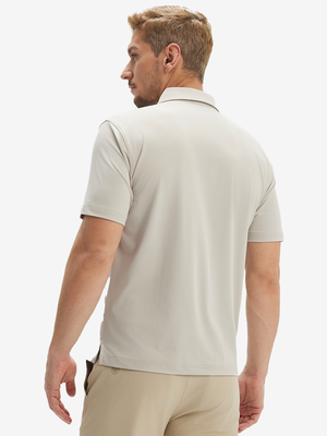 Back half-body view of a model wearing the oyster gray everyday classic solid polo, highlighting the tailored rear fit