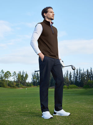 Model holding a golf club on the course, print collar quarter zip golf vest in coffee brown with sporty look